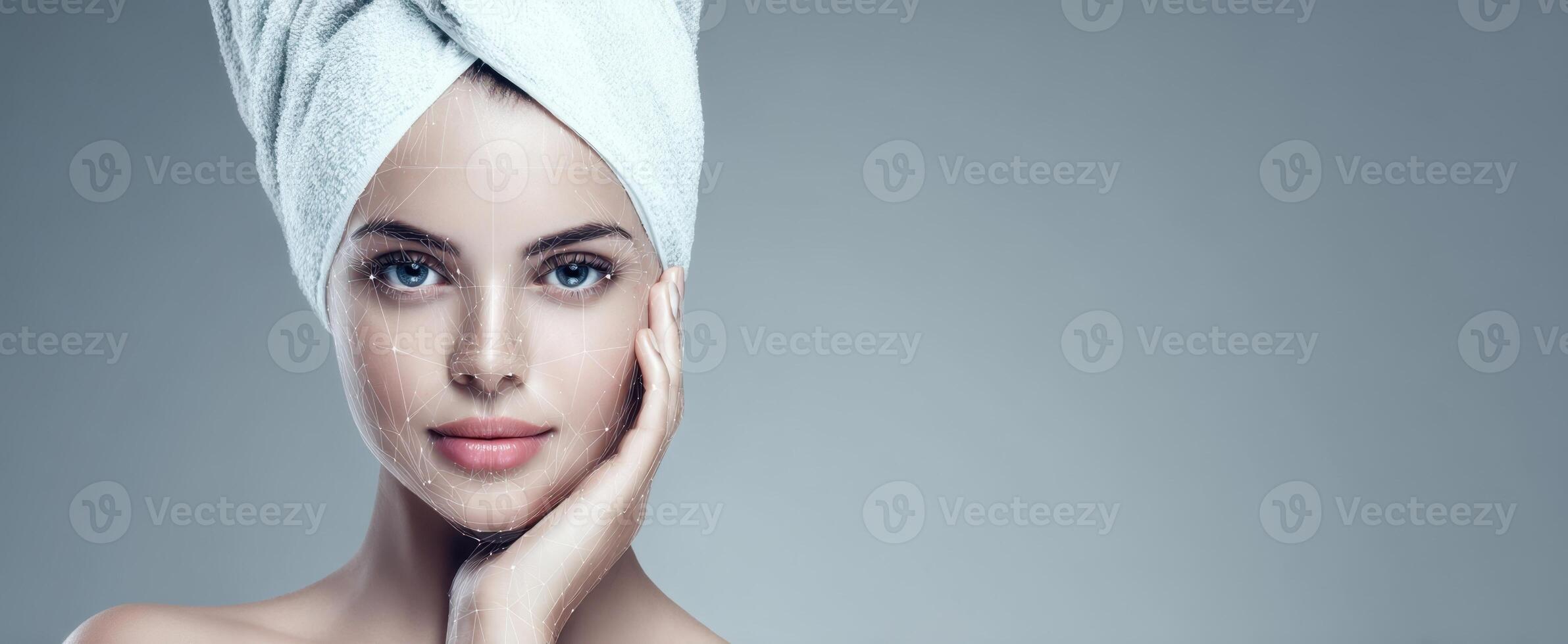 The fresh-faced woman with a towel showcasing beauty and self-care. photo