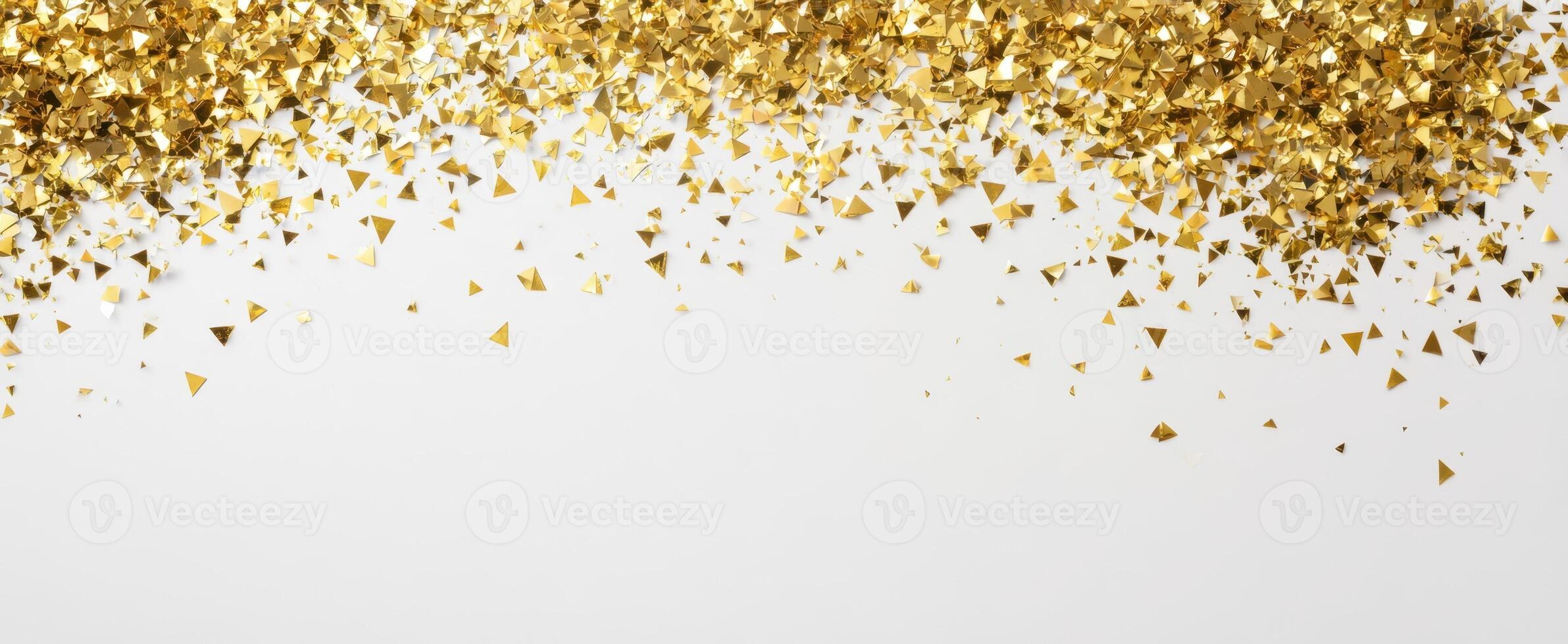 The shimmering gold glitter cascading elegantly on a white background. photo