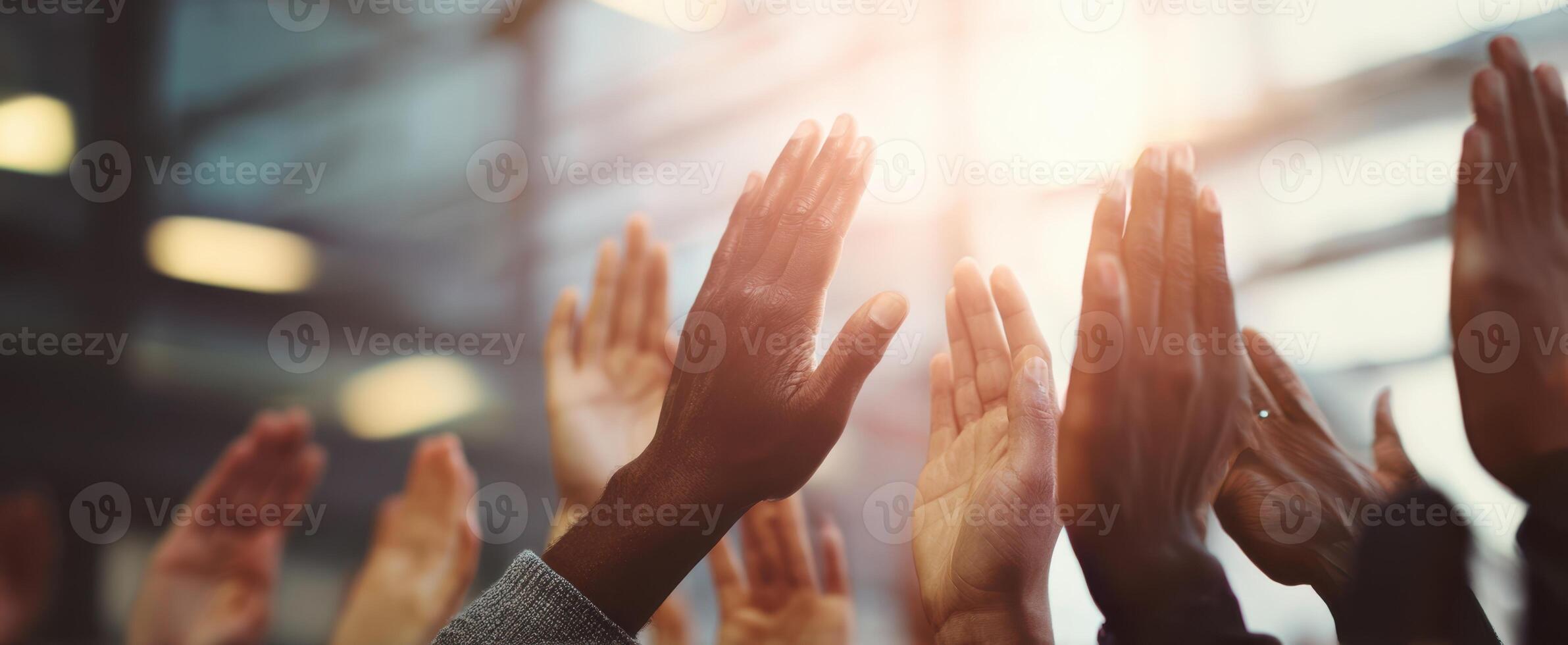 The hands raised in celebration at a dynamic event showcasing community support. photo