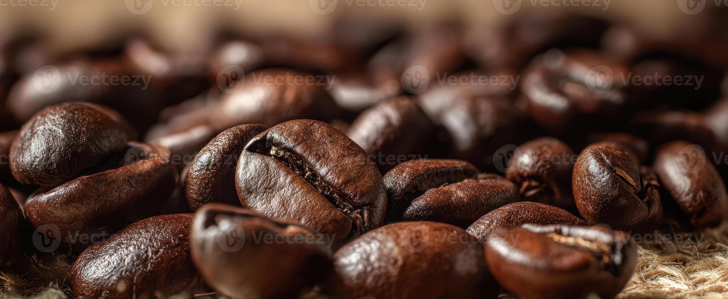 The rich texture of roasted coffee beans close-up on a rustic background. photo