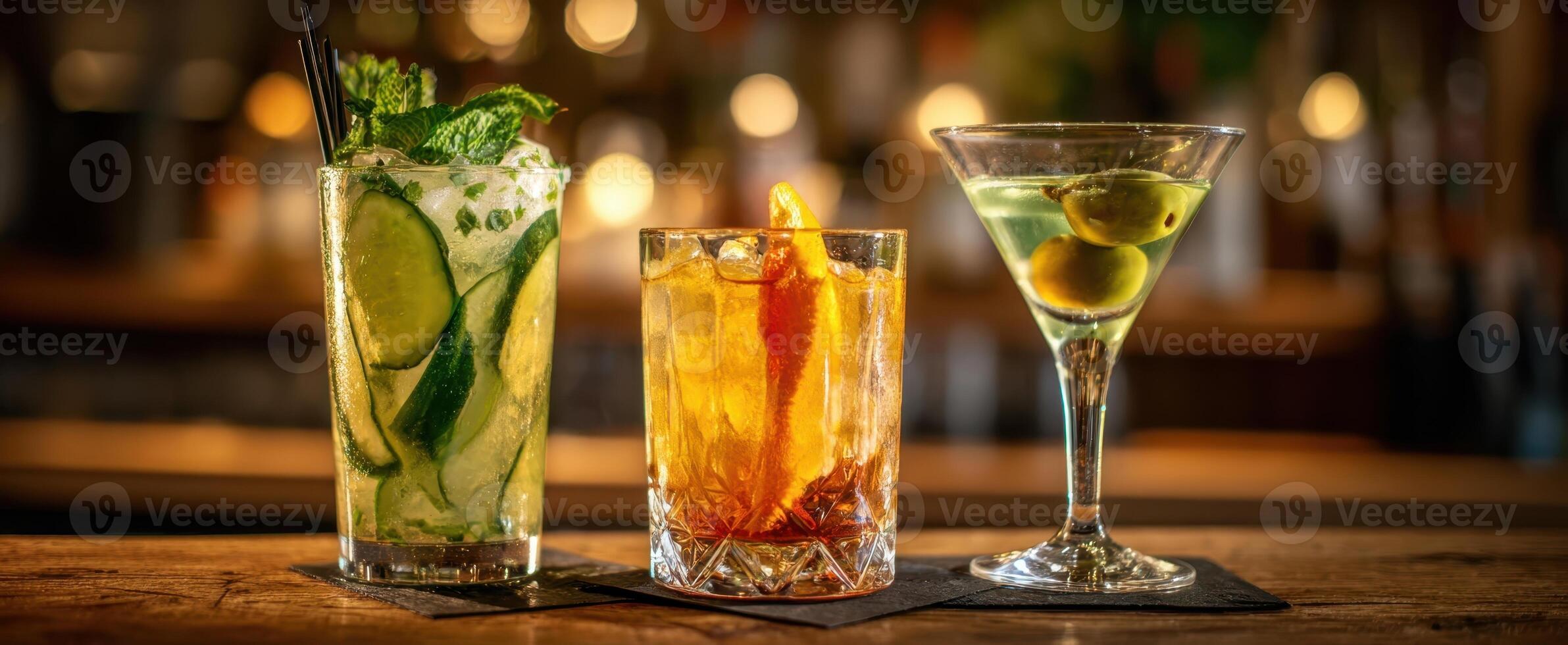 The Three Distinct Cocktails Set Against a Warm Bar Background photo