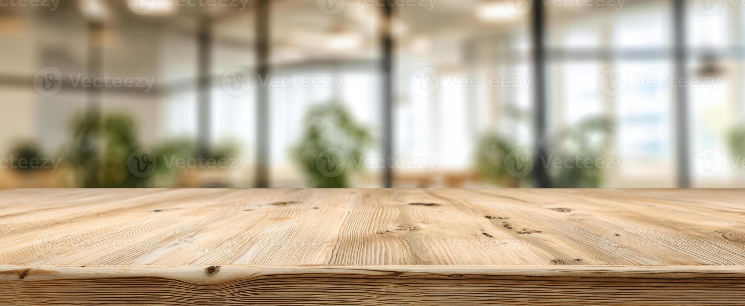 The wooden table showcasing a modern office environment with greenery in the background. photo