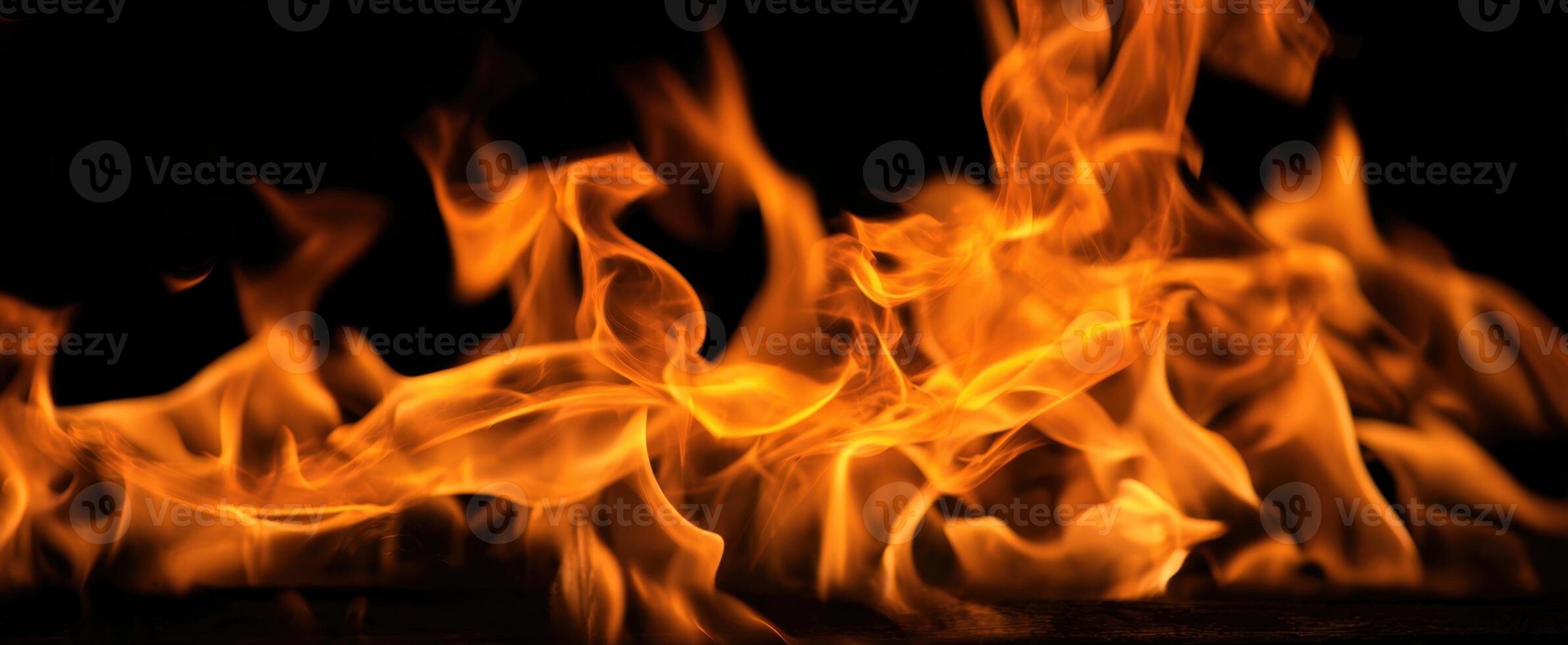 The mesmerizing dance of flames illuminating a dark background. photo