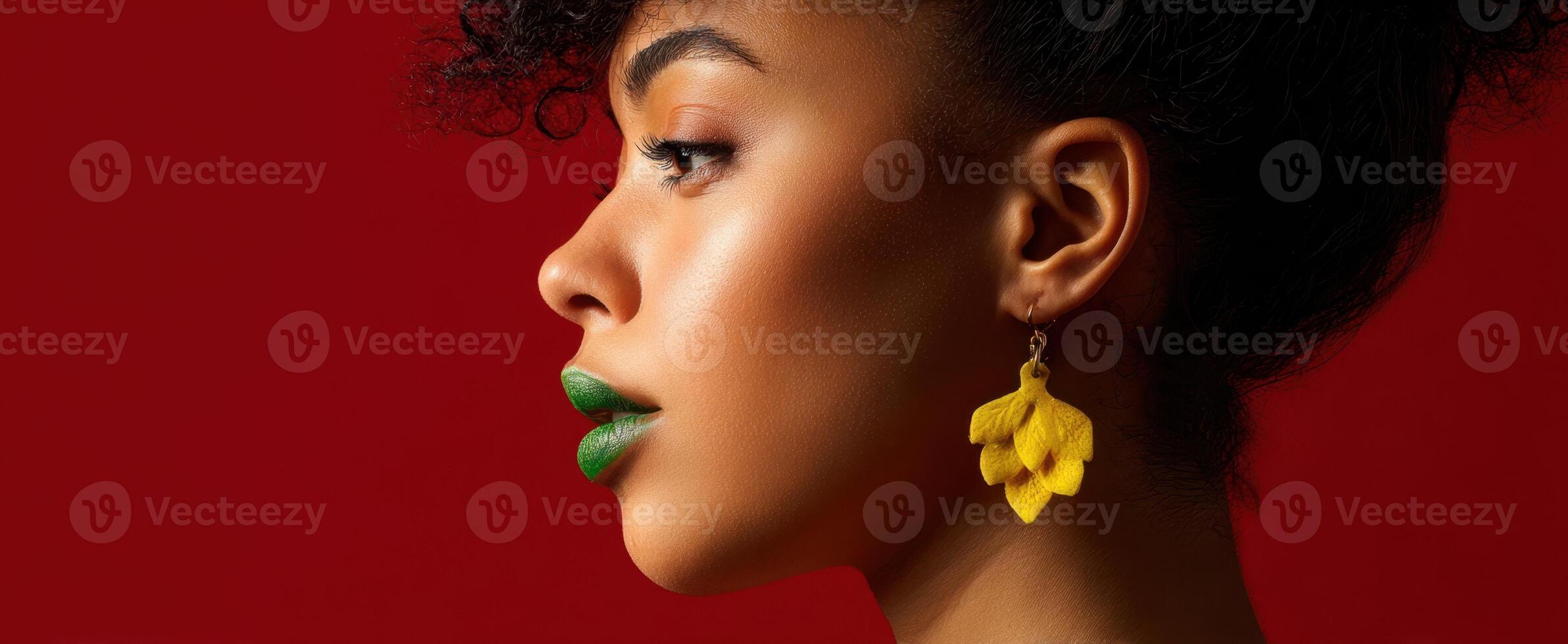 The vibrant profile of a woman showcasing bold makeup and creative earrings. photo