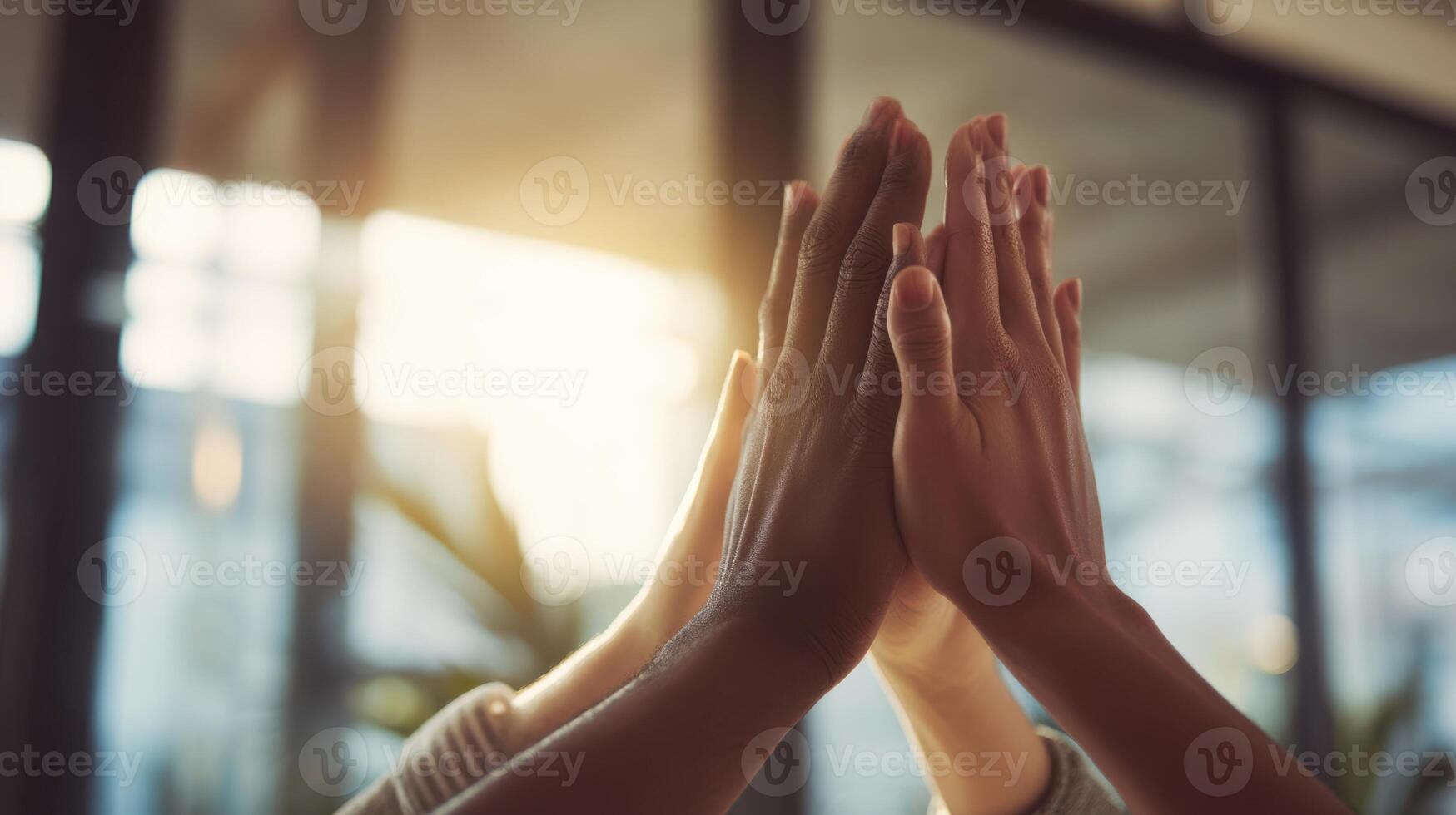 The hands coming together in a joyful celebration of teamwork and unity. photo