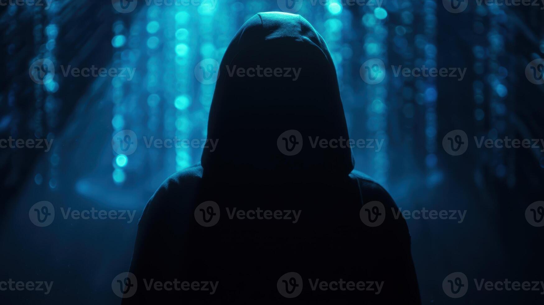 The mysterious figure shrouded in shadows against a shimmering blue backdrop. photo