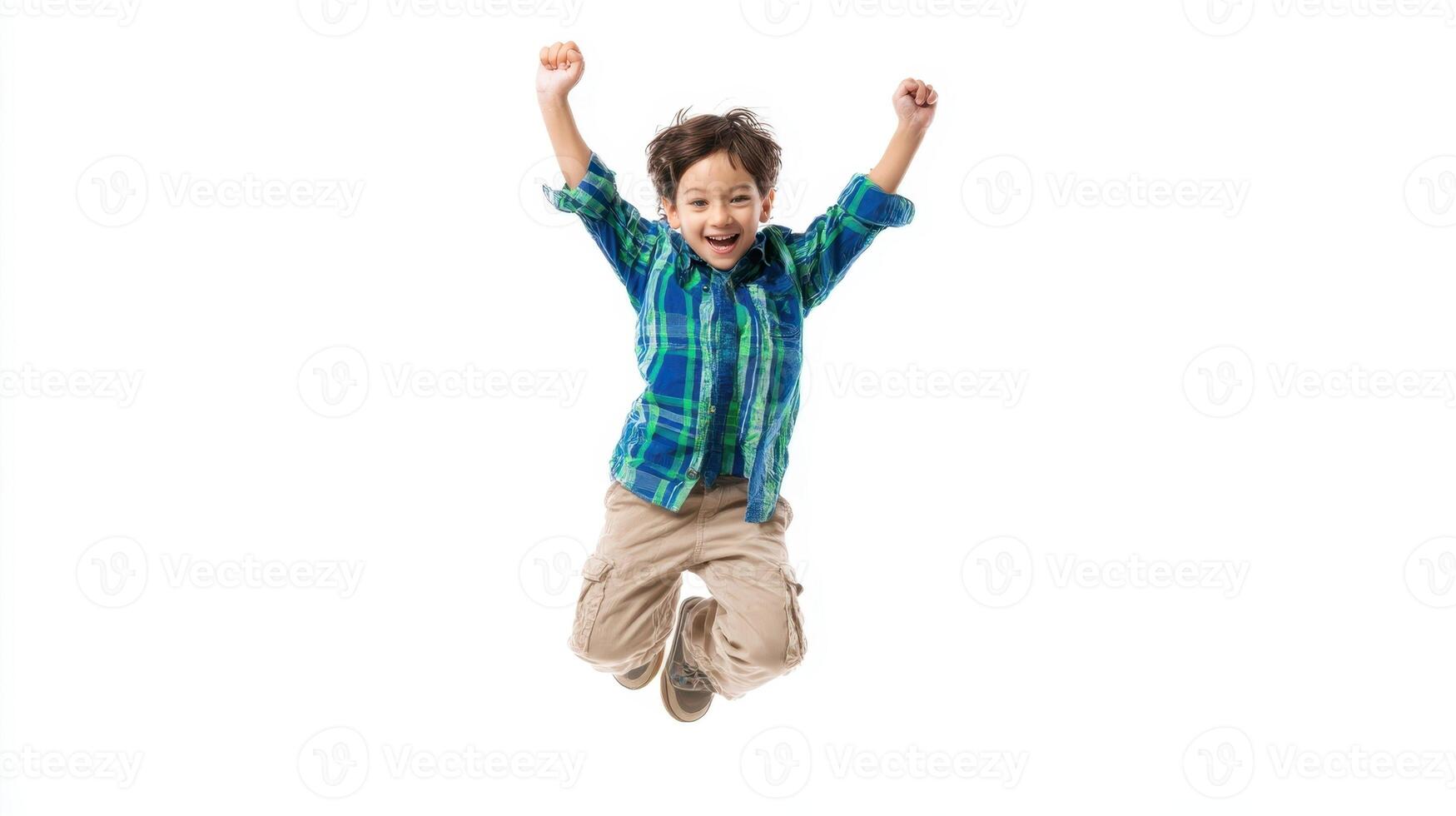 The joyful boy jumping with excitement and energy in playful expression. photo