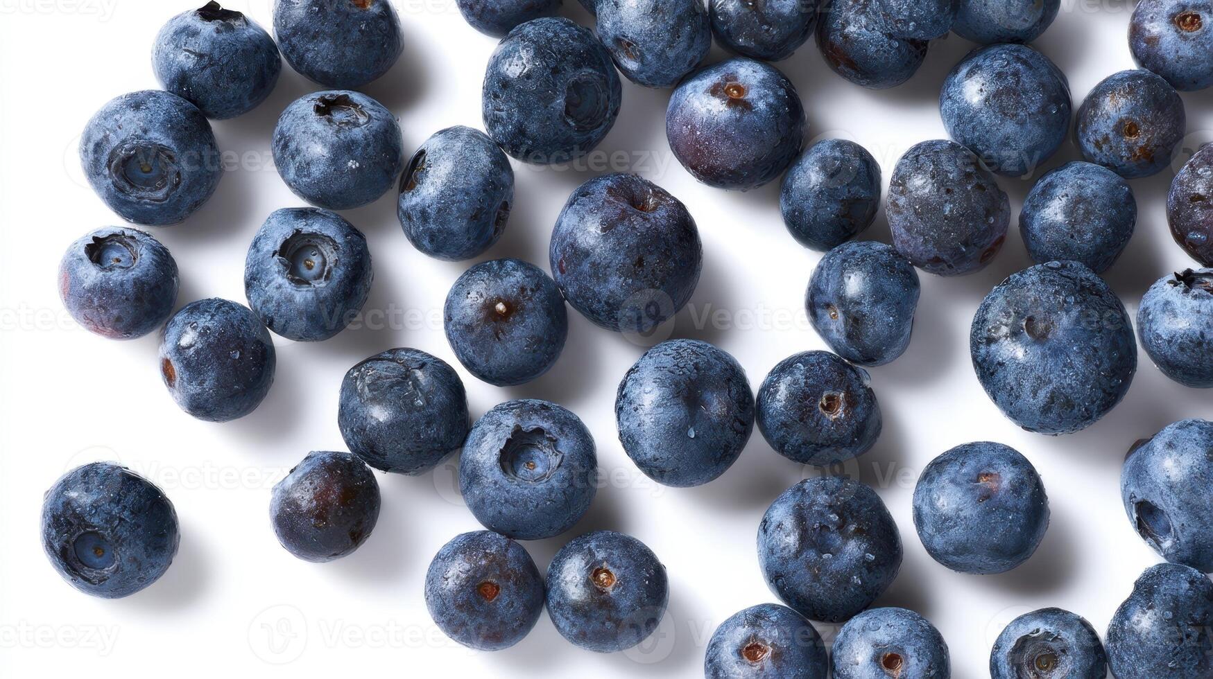 The vibrant blueberries scattered beautifully on a white background. photo