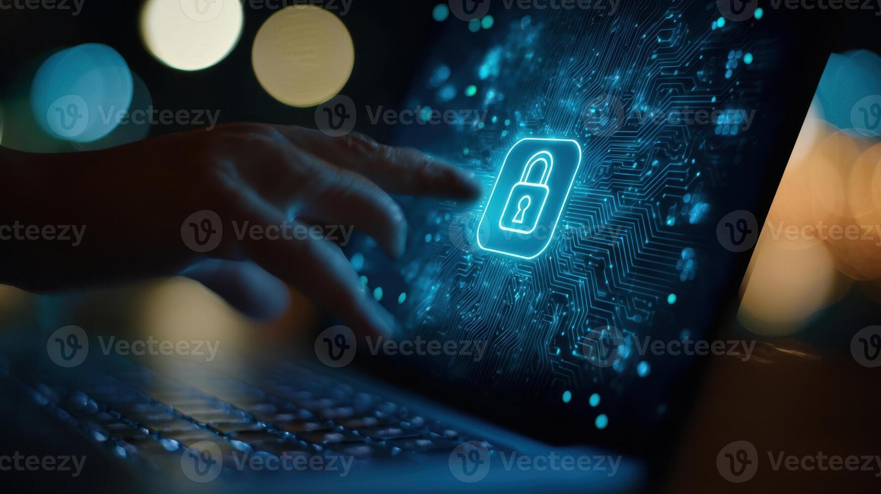 The digital lock symbol illuminating a laptop screen during a cybersecurity interaction. photo