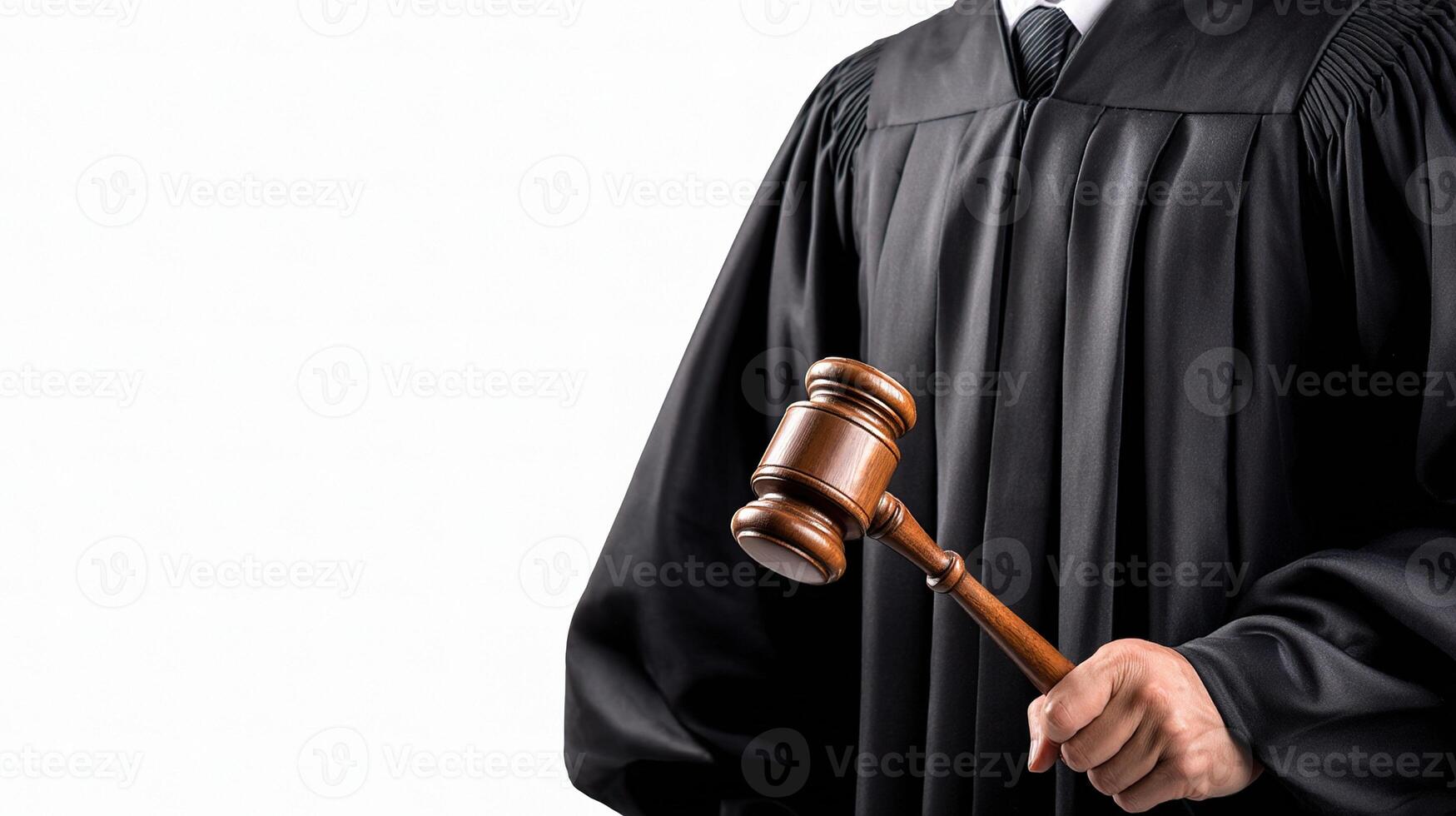 A judge holding a gavel and wearing a black robe photo