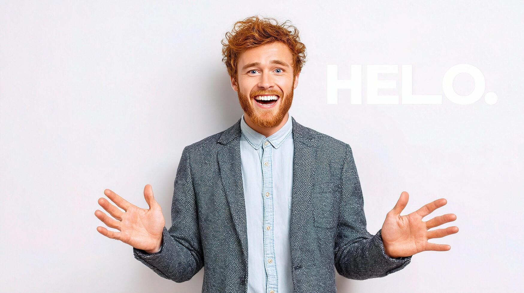 A man with red hair and a suit is holding his hands out in front of him photo