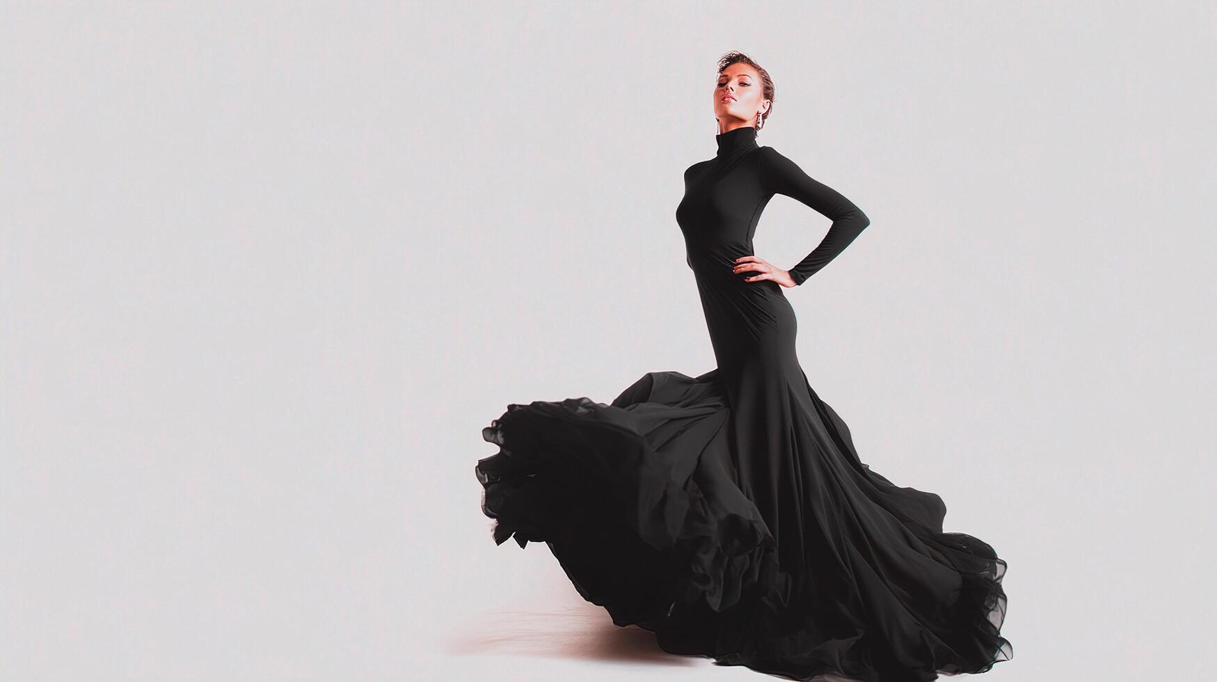 A woman in a black dress is dancing photo