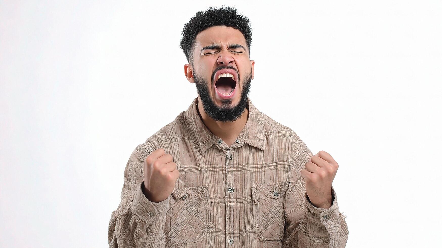 A man with a beard and shirt is yelling photo