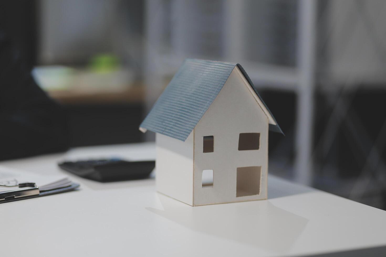 A model house sits on a table photo