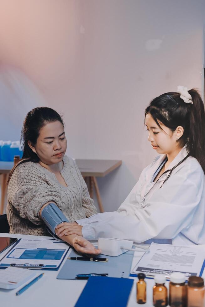 A doctor and patient in a medical office photo