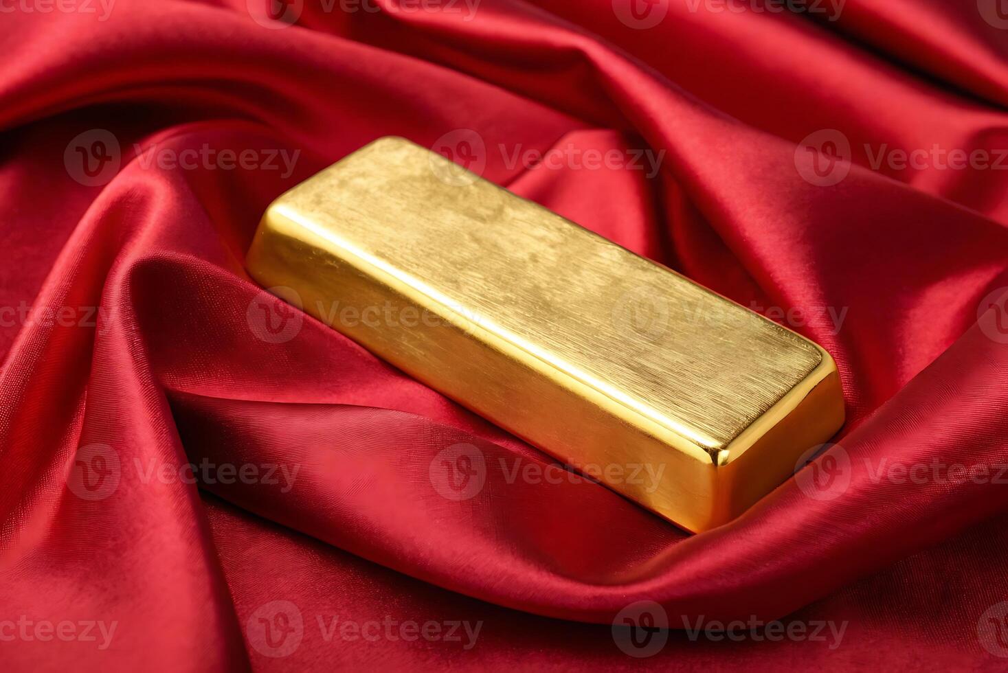 gold bar on red satin cloth photo