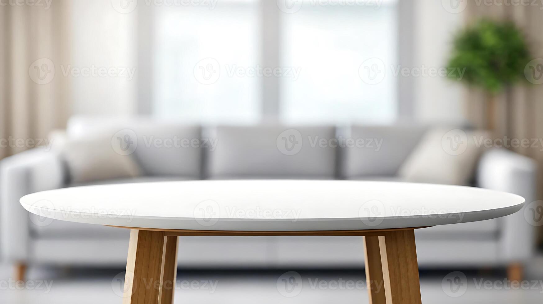 round table with wooden legs in front of couch photo