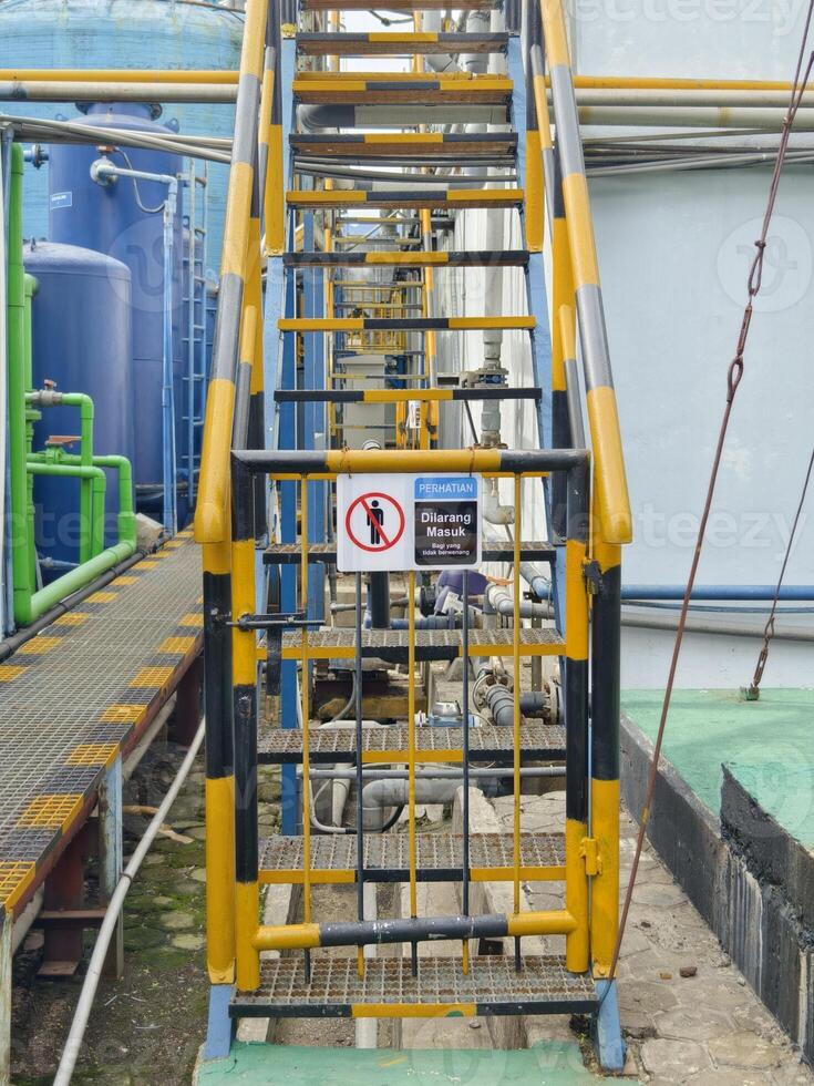 Restricted Access Metal Ladder for Authorized Personnel Only in Industrial Area photo