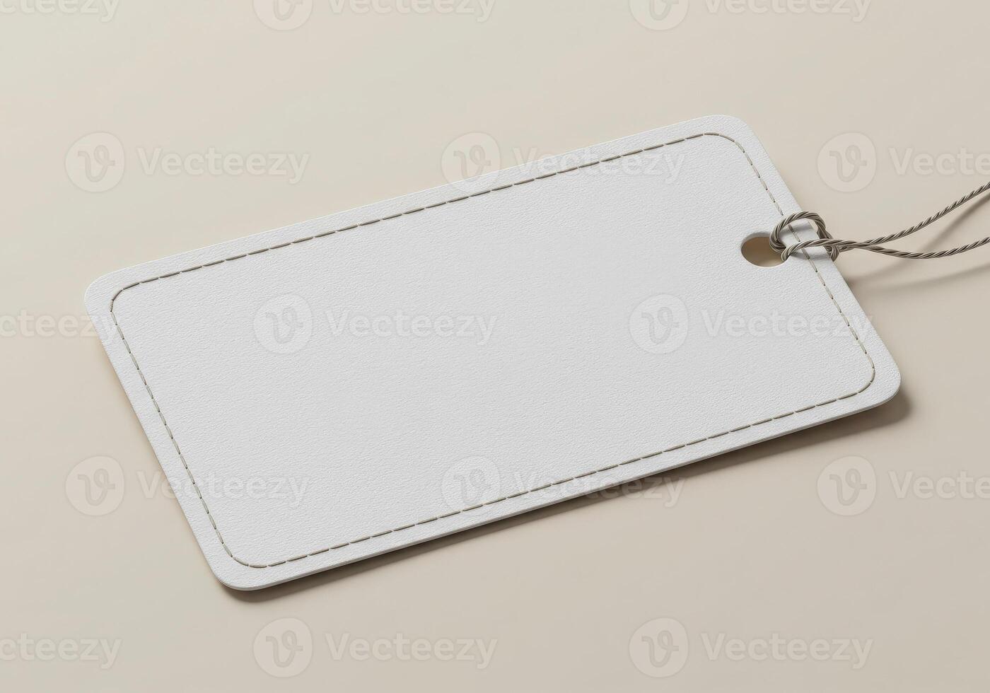 White blank price tag on a beige background photo