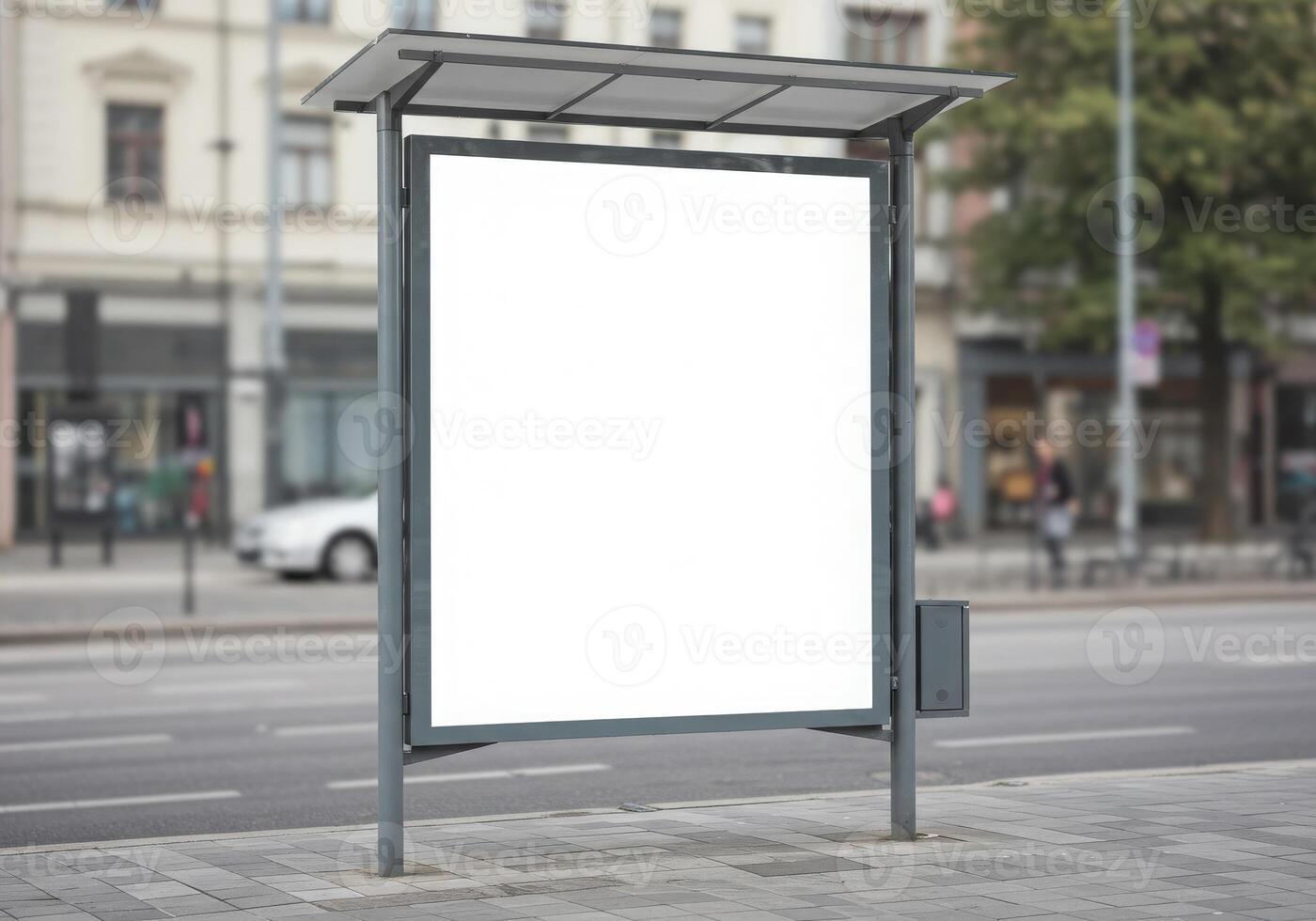 Blank billboard on the street with a car in the background photo