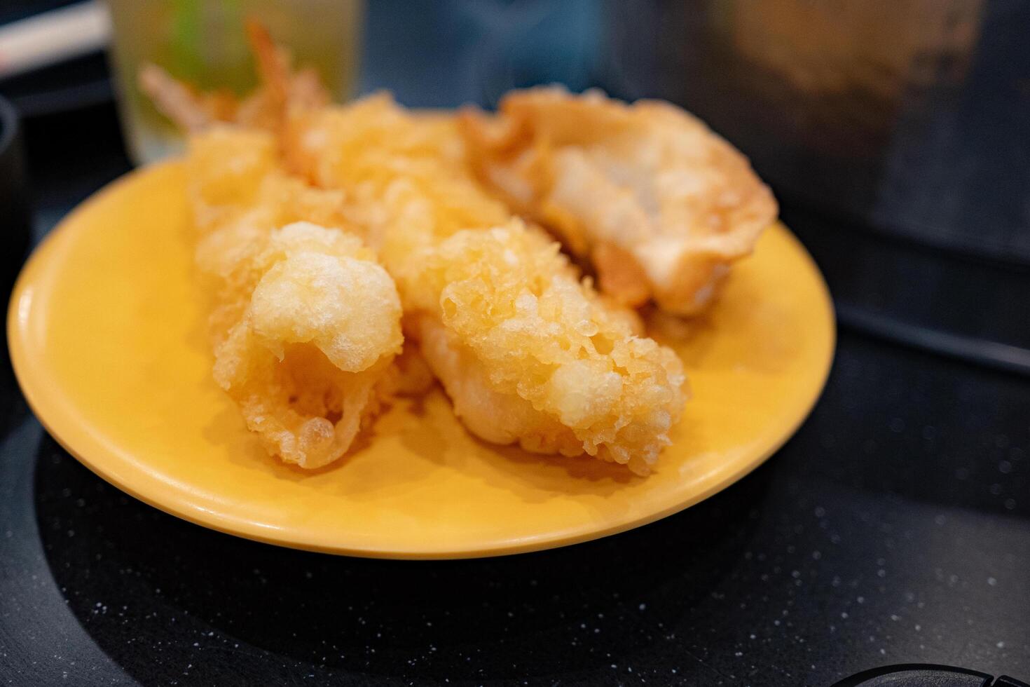 Closeup of Tempura Shrimp in a Yellow Plate photo