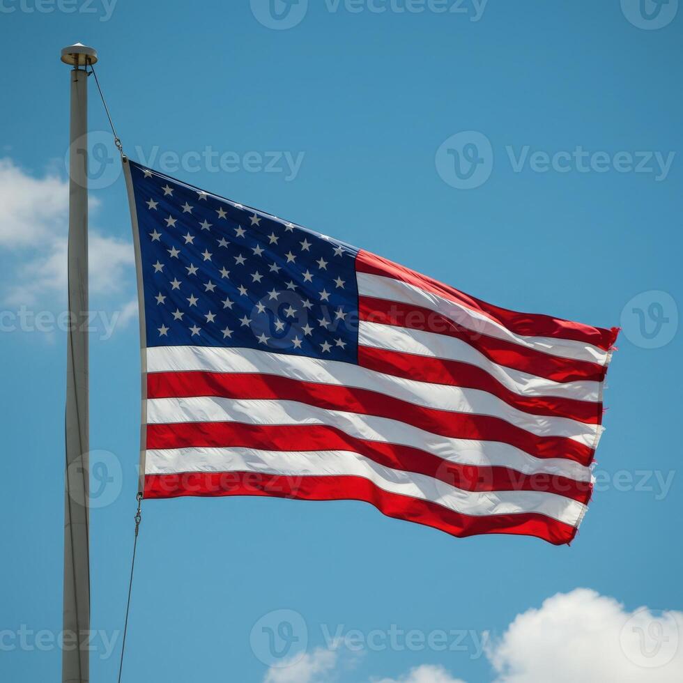 An american flag flying in the wind photo