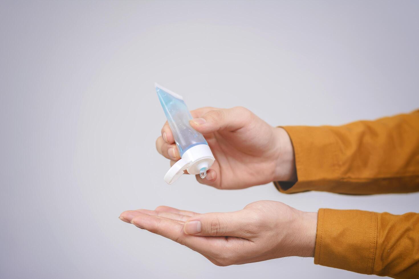 Man hands using wash hand sanitizer gel dispenser, Alcohol gel. Hygiene and Healthcare concept photo