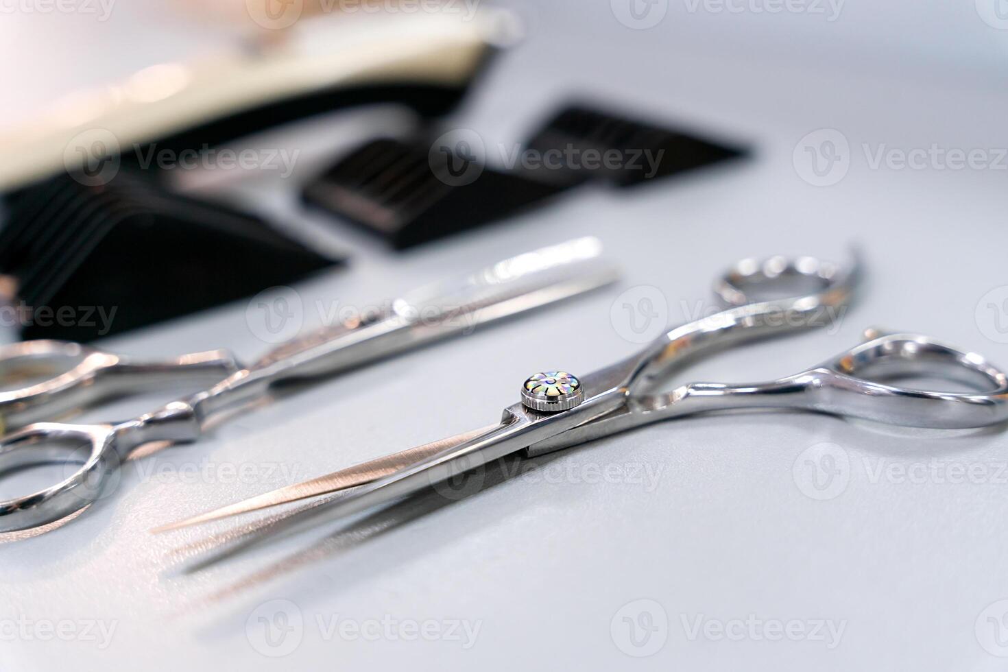 Hairdressing scissors on the table of a hairdresser. Close-up. Selective focus. photo