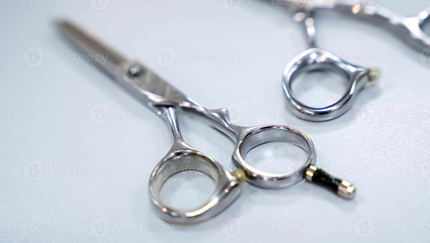 Hairdressing scissors on the table. Close-up. Selective focus. photo