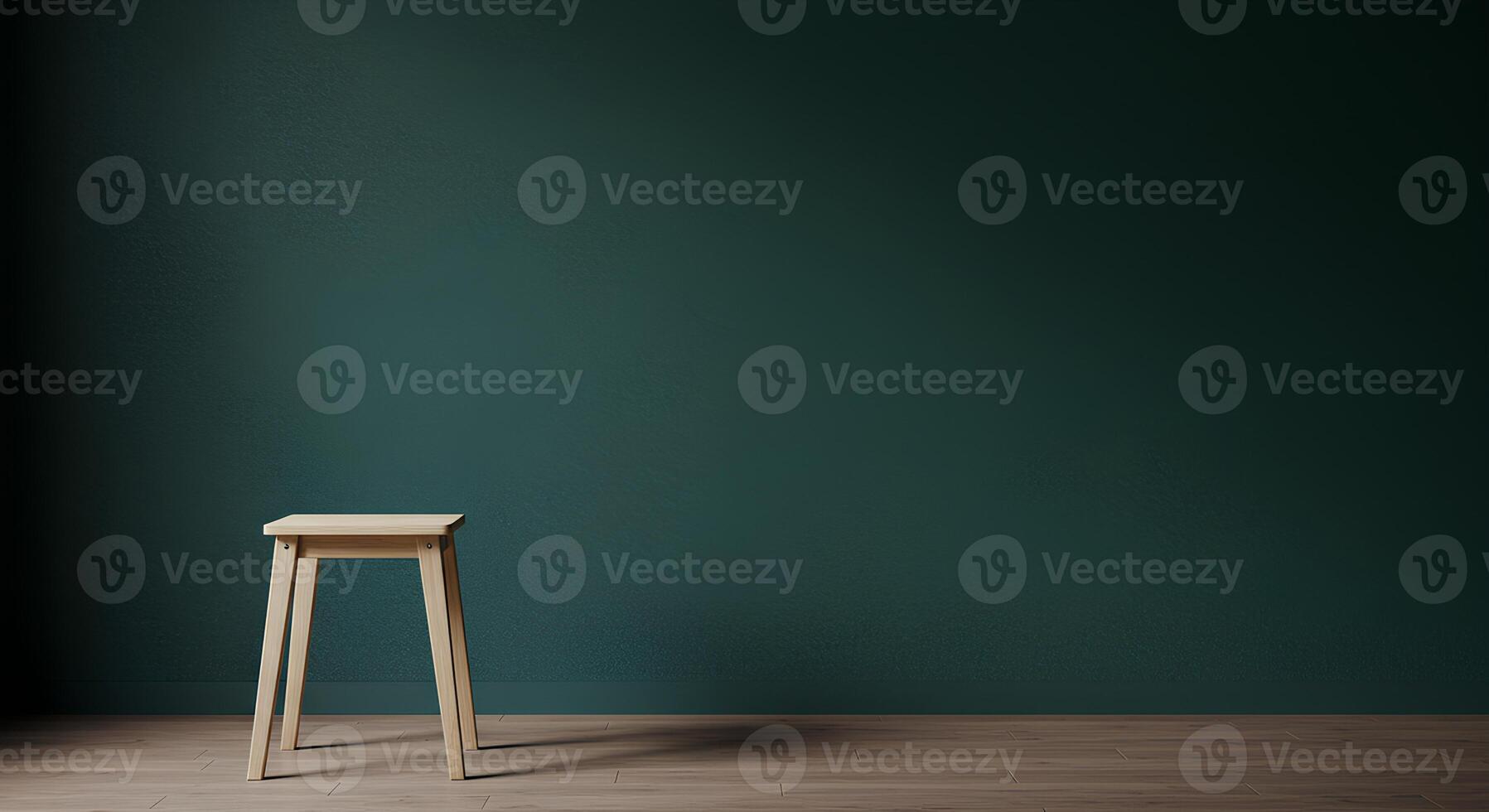 Empty room with teal walls and a light wooden stool. photo