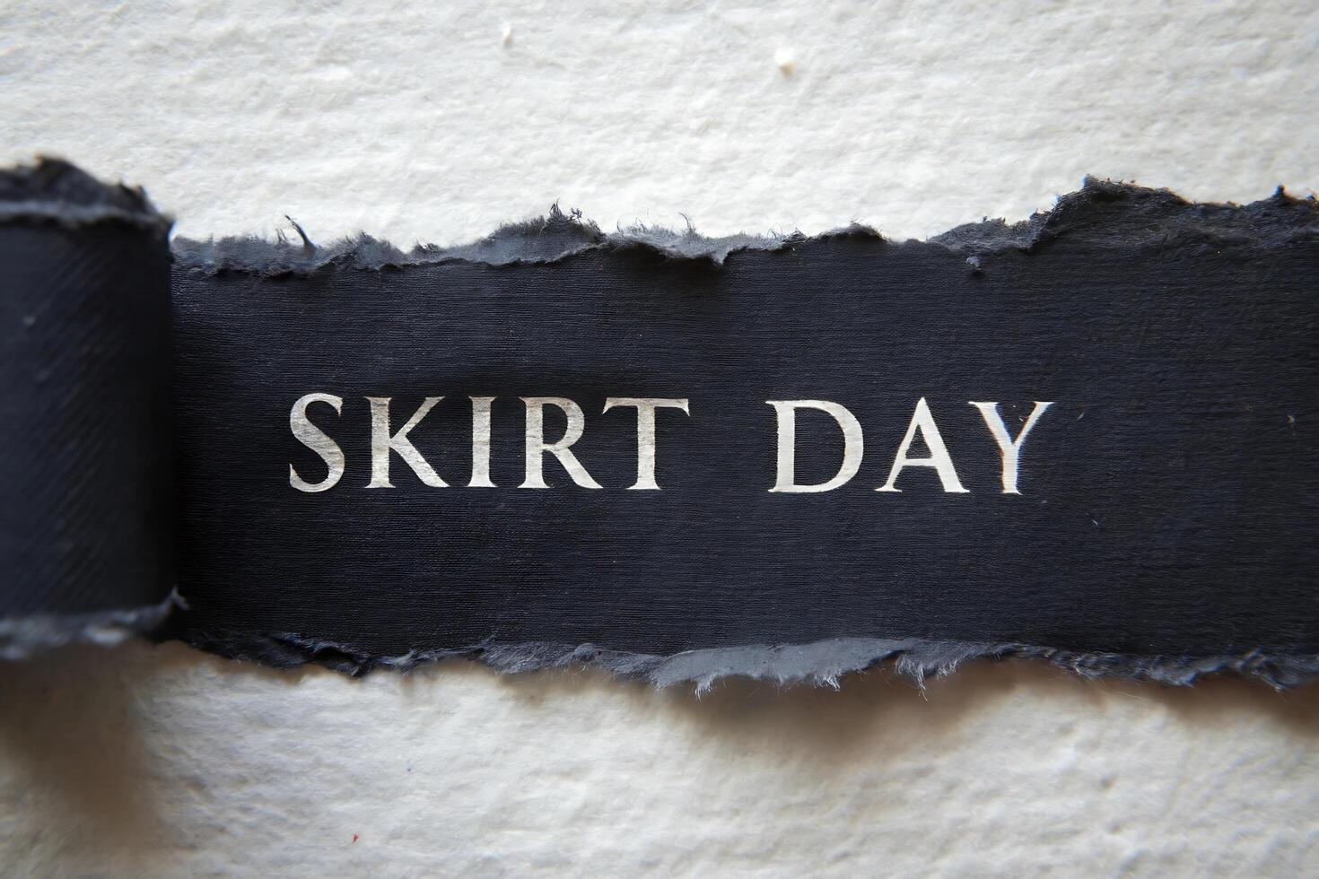 Elegant Torn Paper Reveal with Skirt Day Message for Fashion photo