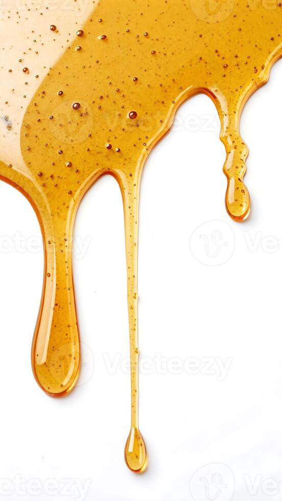 Golden honey dripping down, showcasing its viscous texture and purity photo