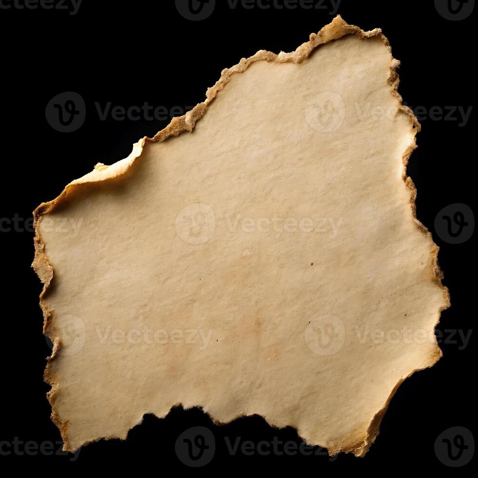 Abstract paper background with burnt and torn edges on black backdrop photo