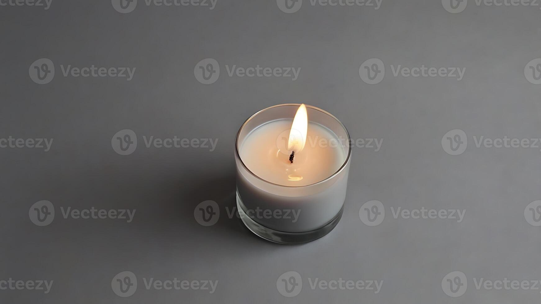 Minimalist Candle Still Life on Grey Background with Soft Lighting photo