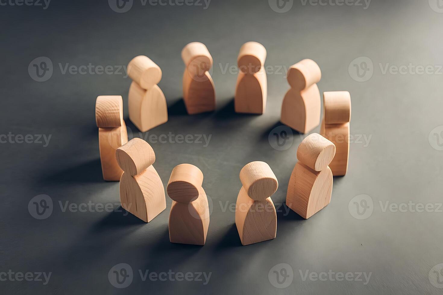 Wooden Figures Standing in Circle Symbolizing Teamwork and Unity photo