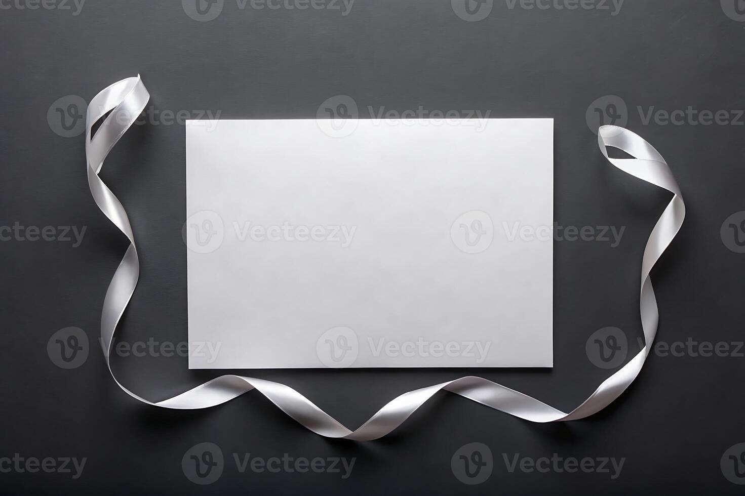 Elegant stationery mock-up with silver ribbon on dark gray background photo