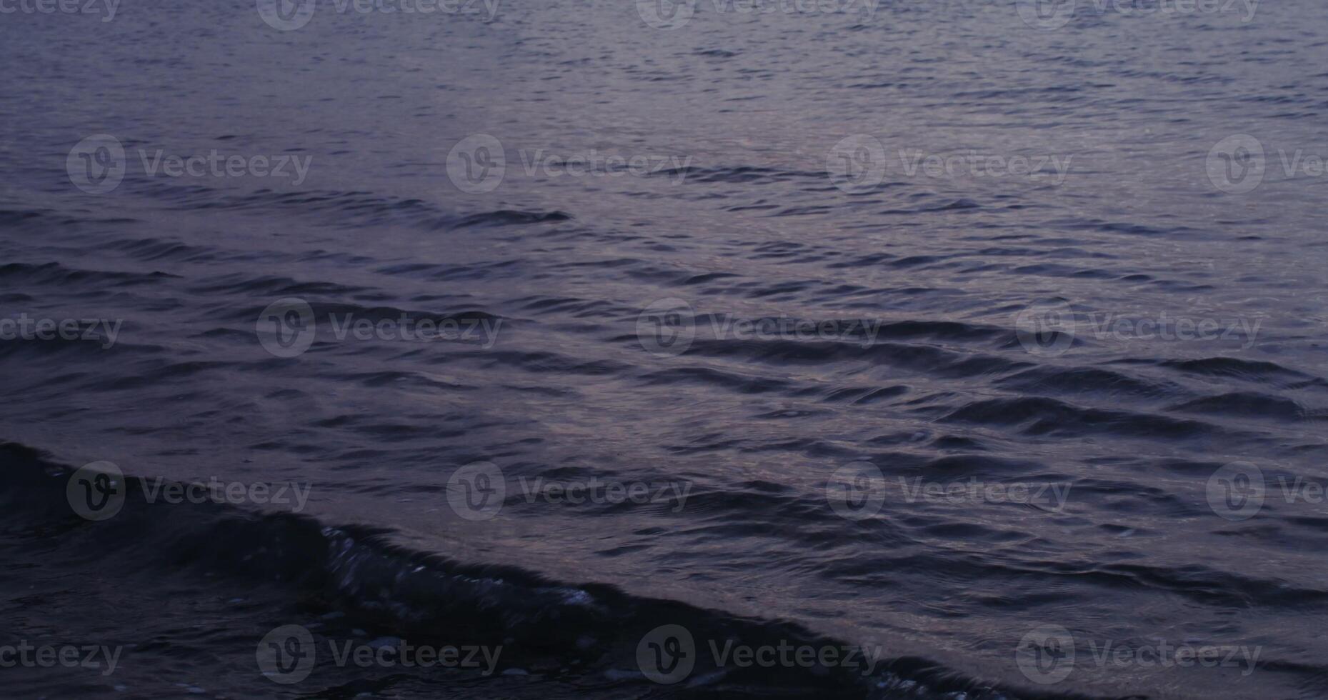 Sea or ocean wave with small waves. Crystal clear sea water, waves crashing against the shore, the coastline is not visible. in 4 k, red komodo. photo
