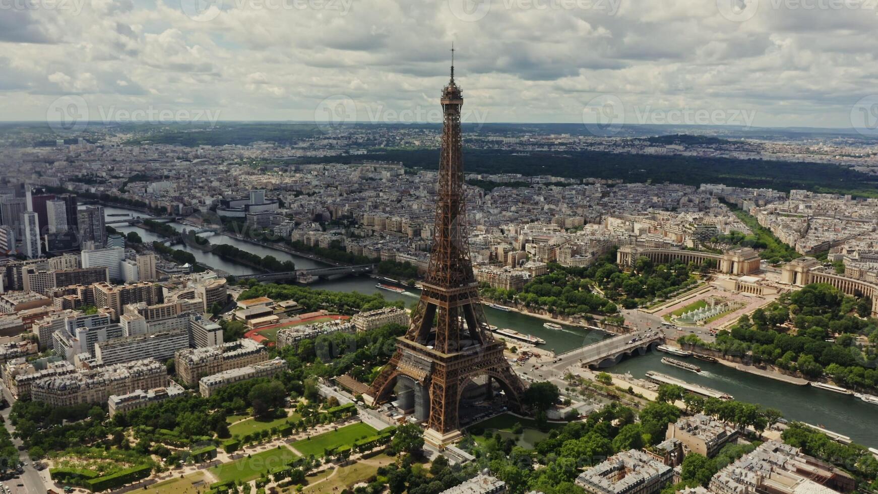 Drone horizontal panning view of the historic center of Paris with the Eiffel Tower and the Seine River in the foreground on a summer day. France Paris photo
