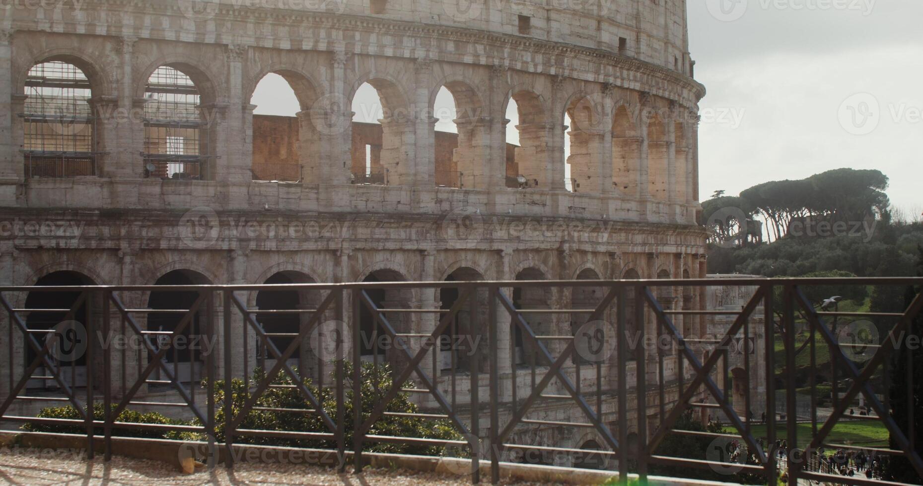 The Coliseum on a sunny warm day. Italy tourist attraction, Rome. Many tourists at the foot of the monument of architecture. in 4k, red komodo photo