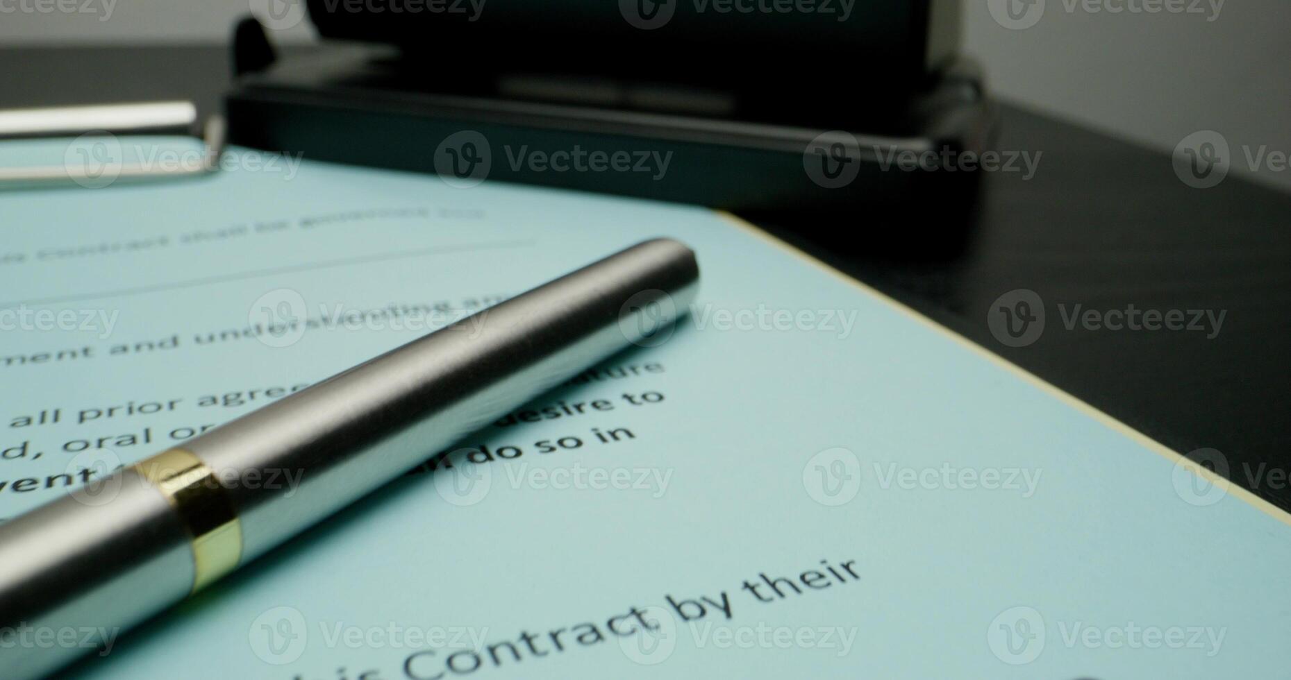 A signed contract, close-up of the signatures of the employer and the employee, the movement of the on the document photo