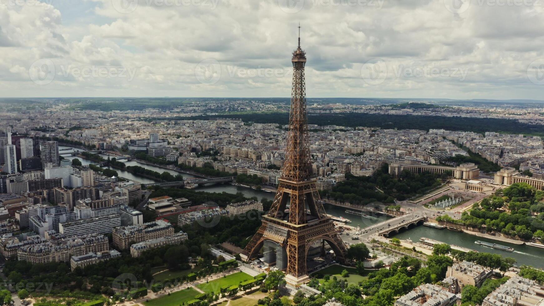 Drone horizontal panning view of the historic center of Paris with the Eiffel Tower and the Seine River in the foreground on a summer day. France Paris - historic photo