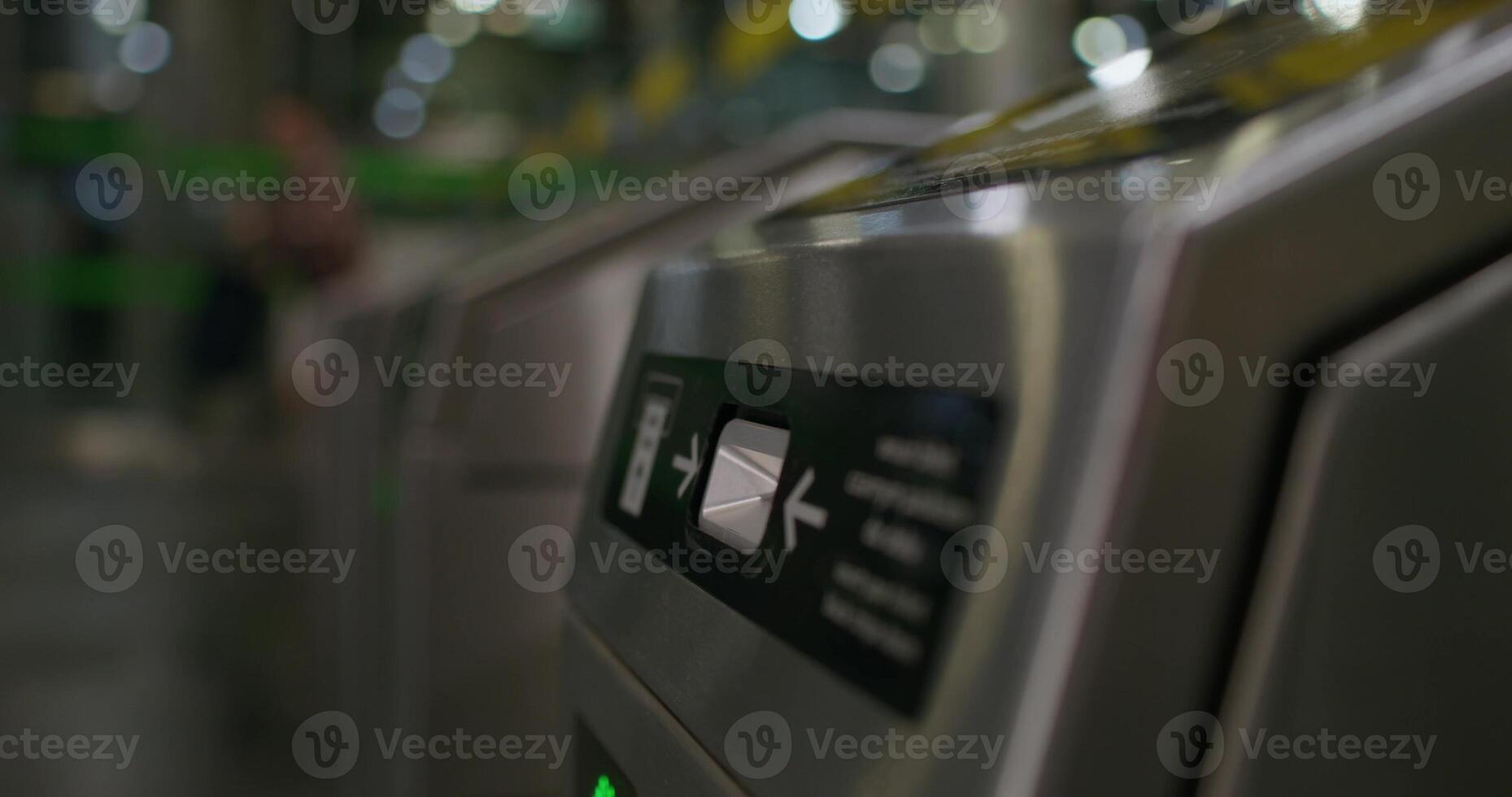 A woman inserts a card into a subway terminal and passes through. close-up of her hand, an unrecognizable person - terminal photo