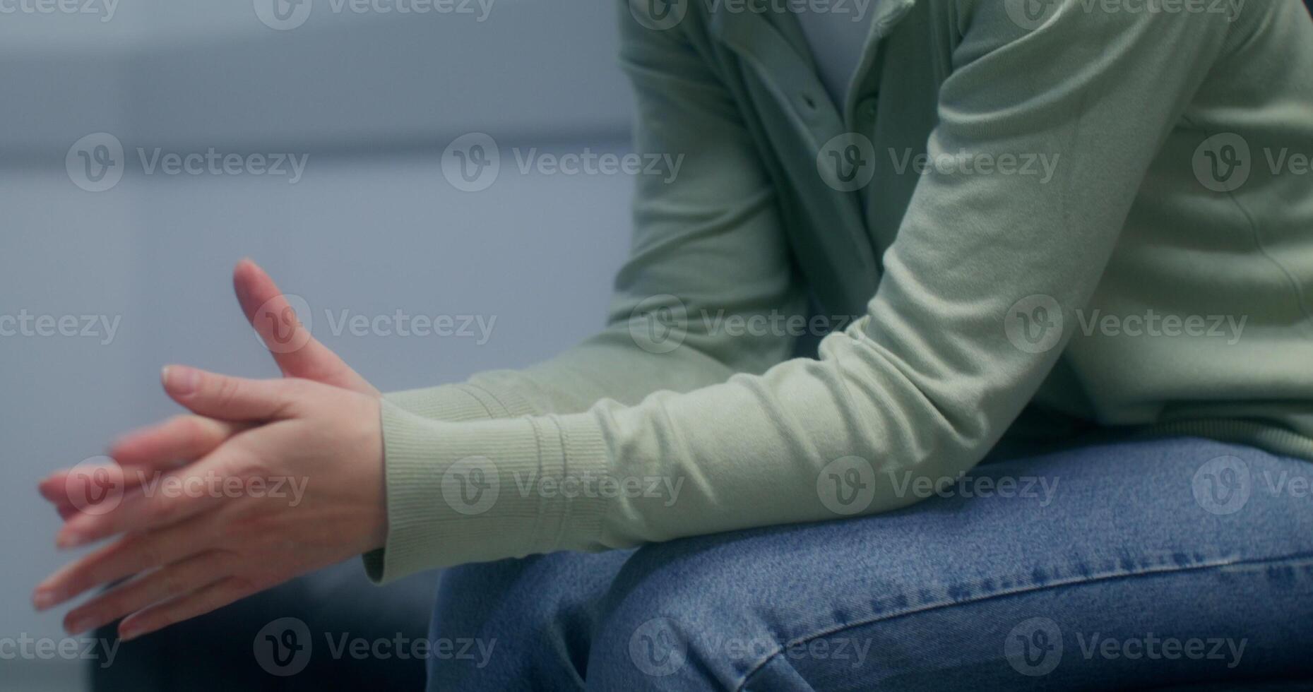 A woman is worried sitting in the hospital corridor and waiting for the result of her loved one's operation - hospital photo