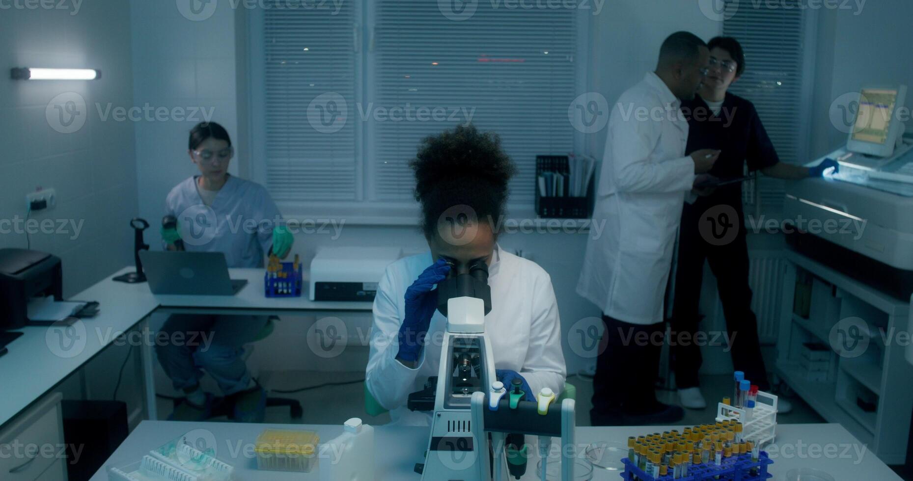 Work in a medical laboratory, working with a microscope photo