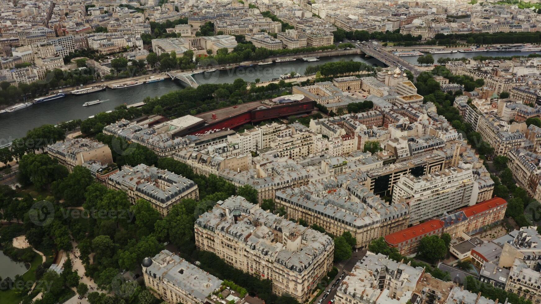Cityscape of Paris from a bird's eye view. Drone flies over residential areas on the banks of the Seine. Rooftops home of Paris, France aerial view - Rooftops photo