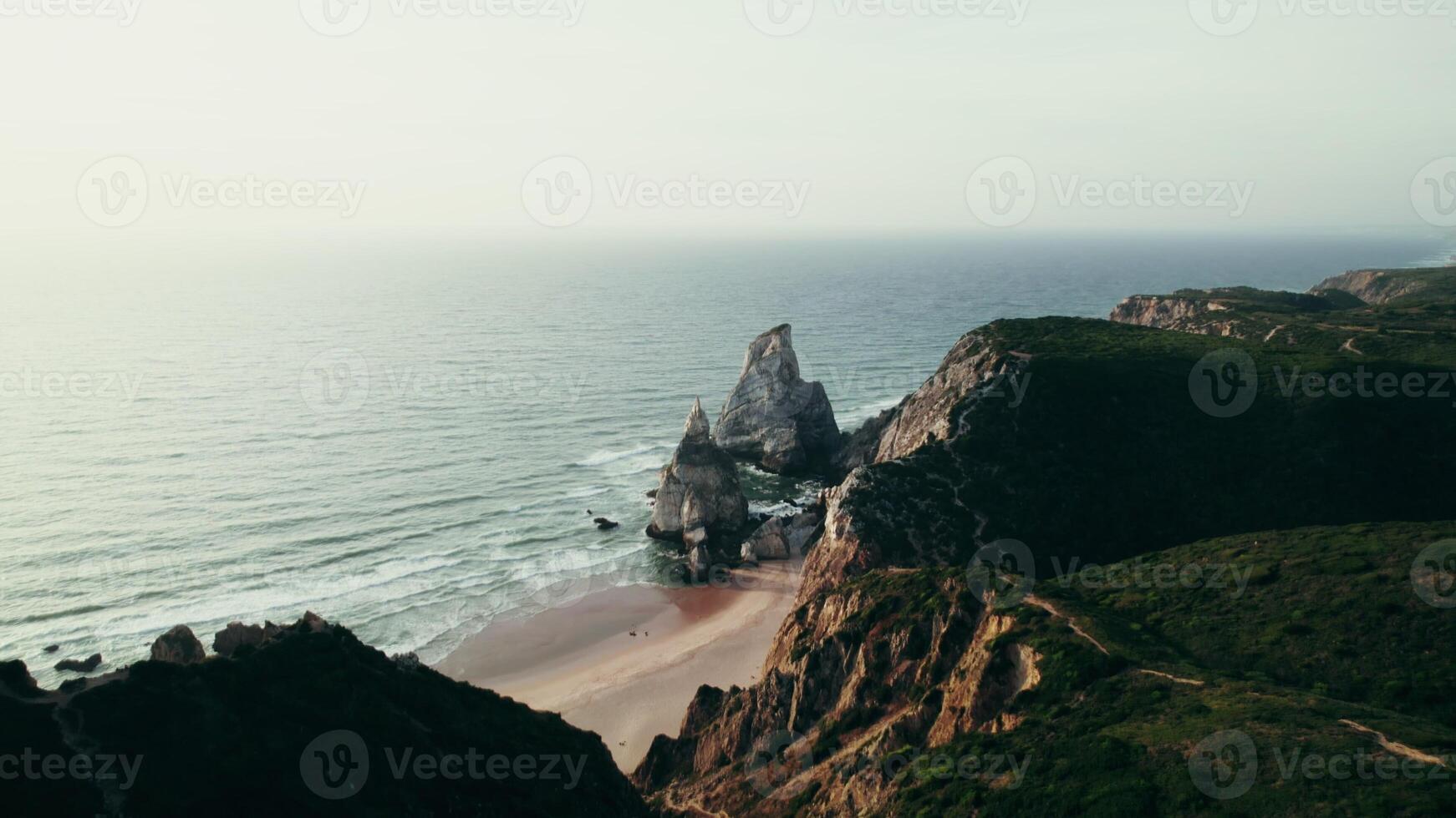 The sea at the foot of the mountains, a bird's-eye view from the mountains to the sea distance photo