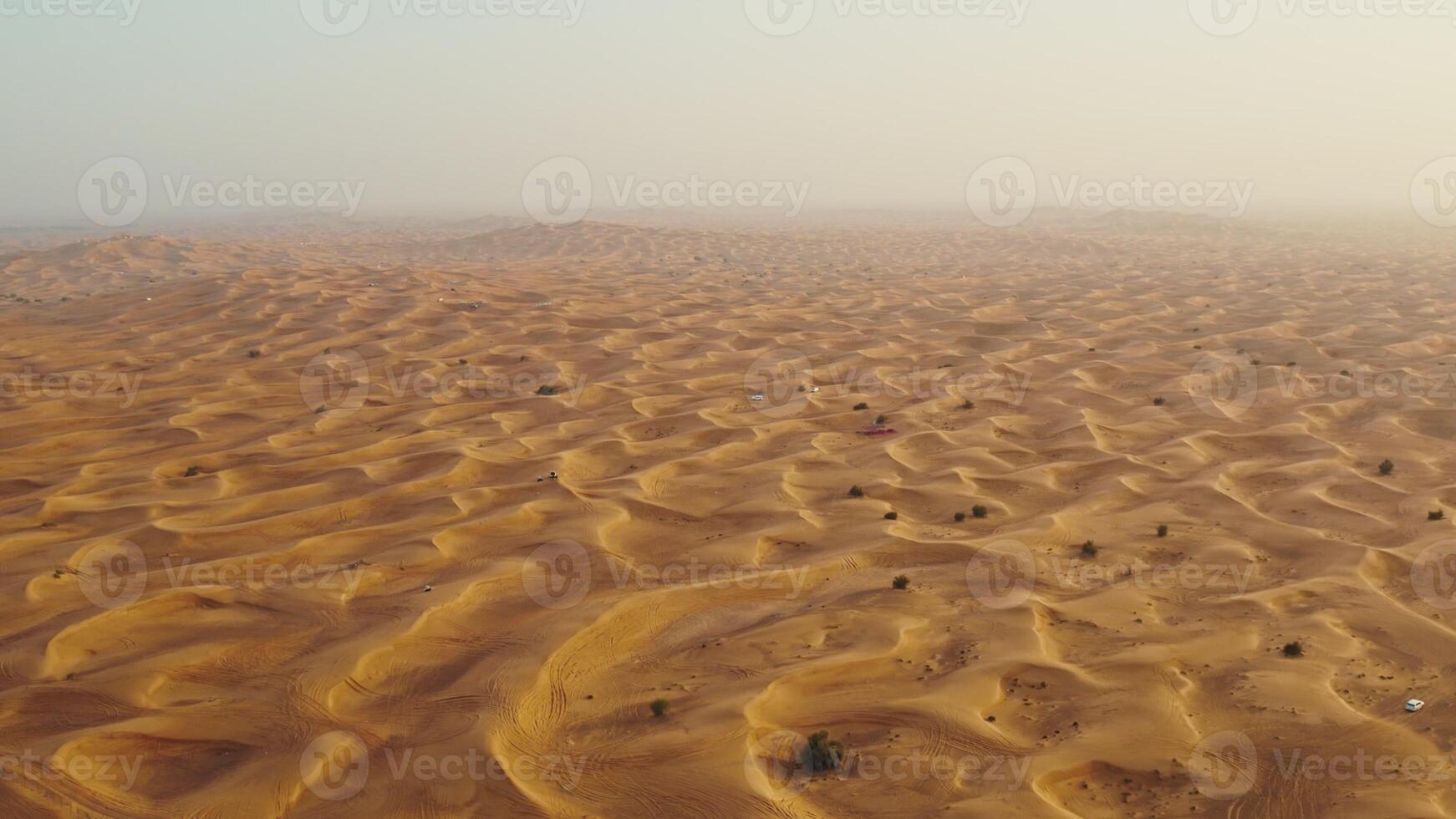 Drone view of sand dunes with sand merging with the sky. Driving off-road in a lifeless desert - desert photo