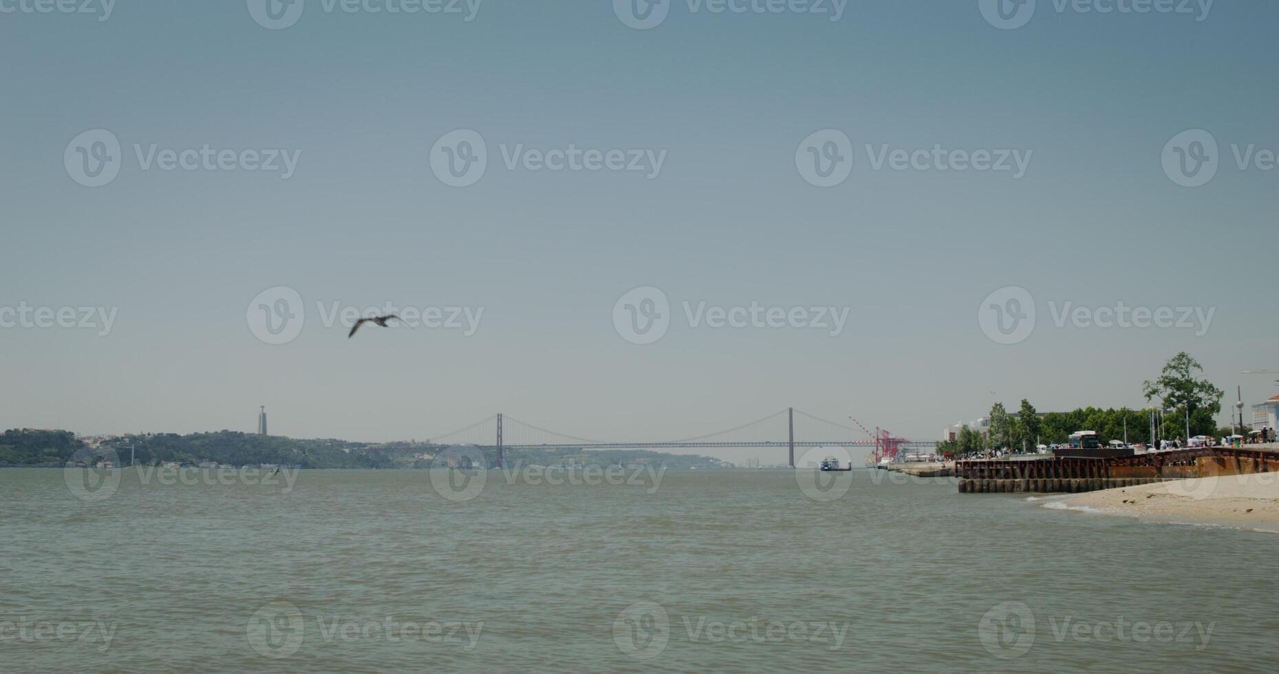 Panoramic view of the hanging bridge in Portugal over the Tagus River photo