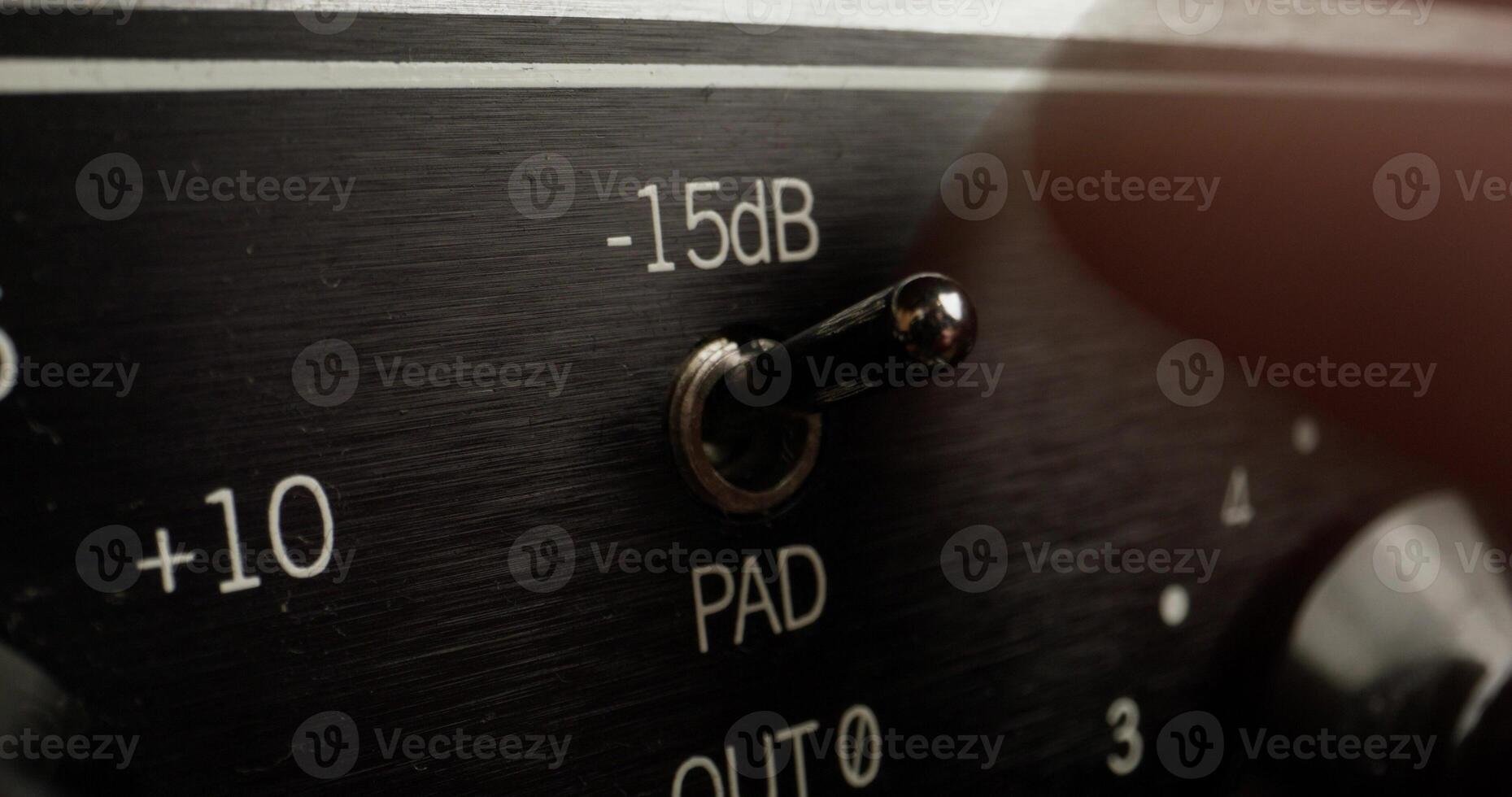 A man adjusts a device to measure the sound level, close-up of his hand, an unrecognizable person - adjusts photo