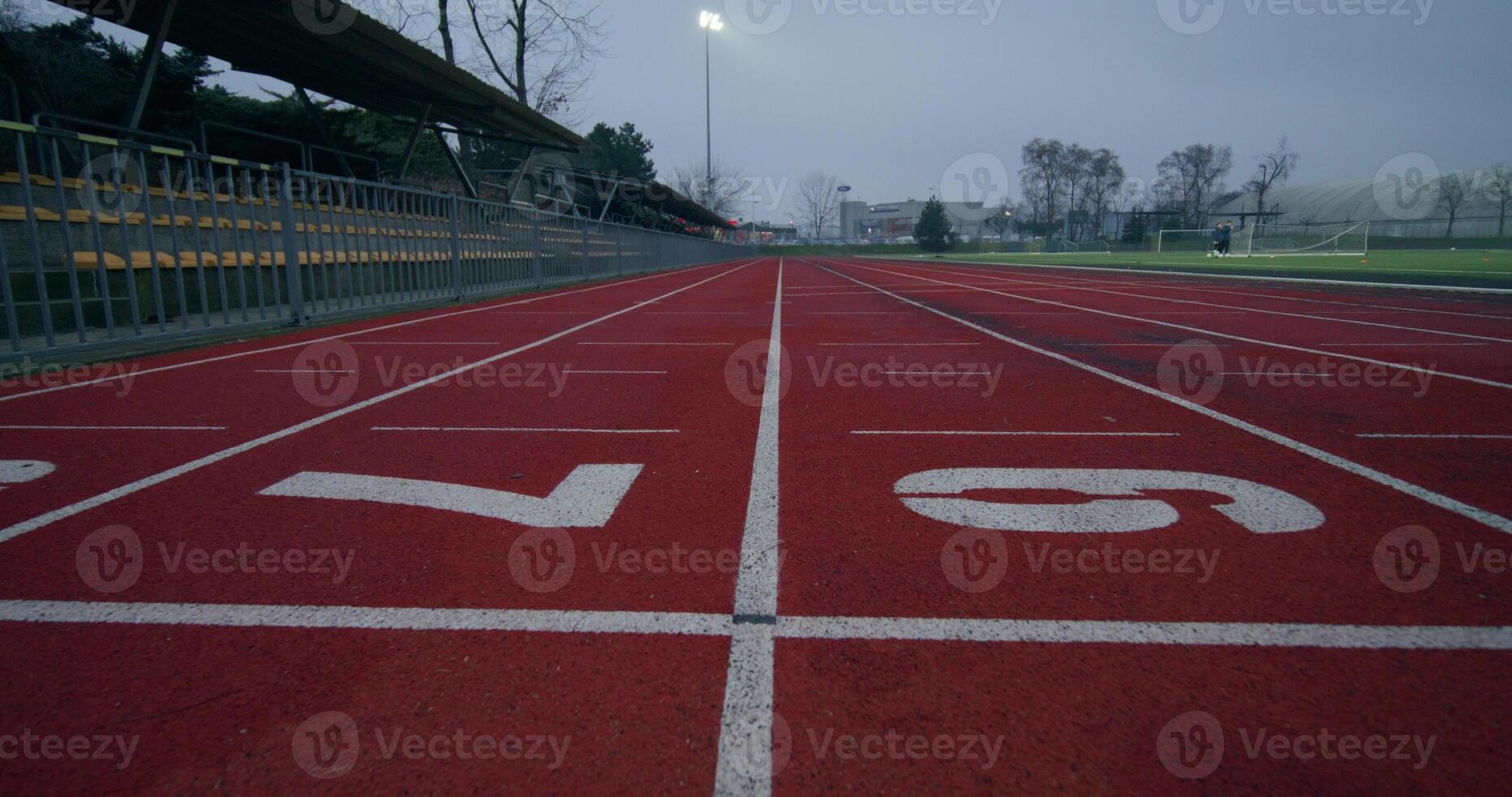 Running tracks in the stadium, close-up of the lined and numbered outdoor stadium flooring - numbered photo